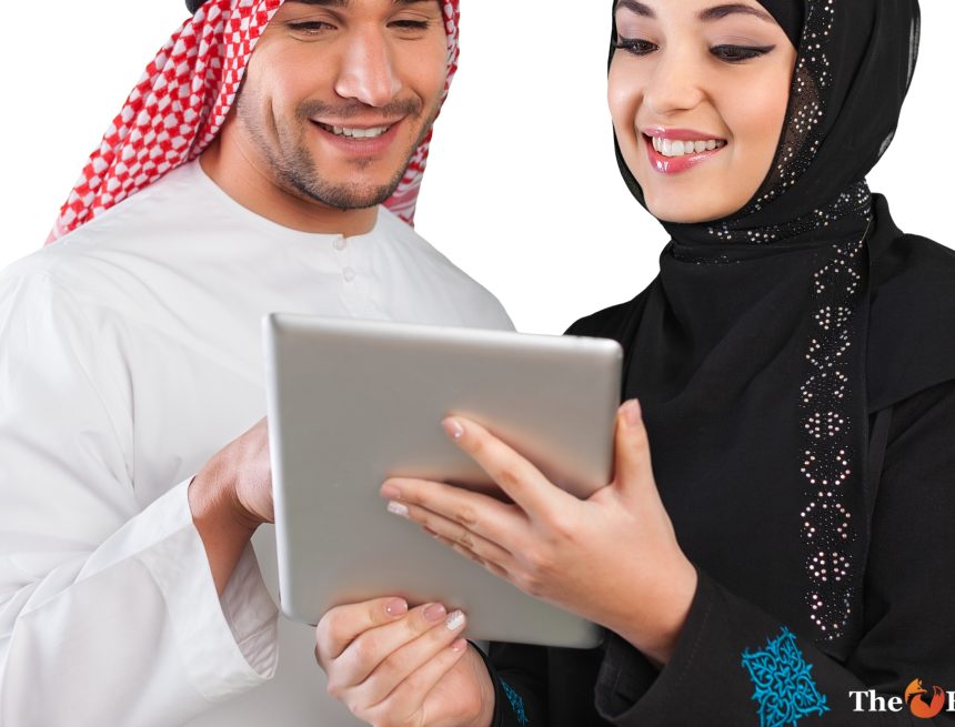 Arab Couple Looking at Tablet