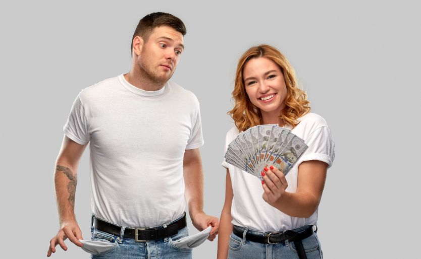 Couple with Money and Empty Pockets